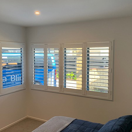 Shutters have added to the feeling of space in this bedroom