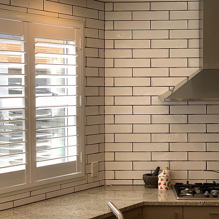 Shutters enhance the freshness and vibrancy of this kitchen