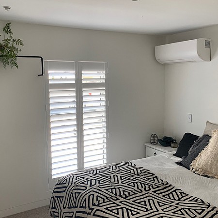 Bedroom Shutters create space. By Betta Blinds