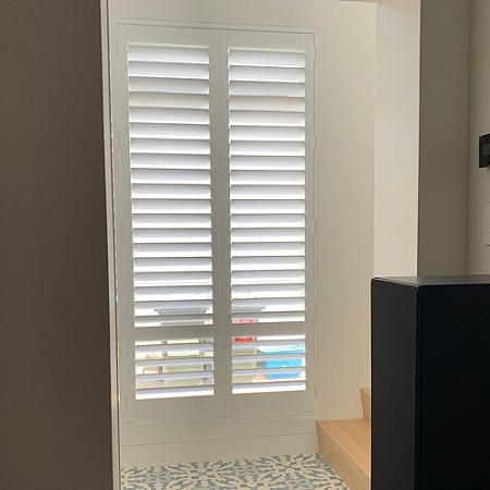 Shutters create elegant front entrance by Betta Blinds